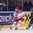 MINSK, BELARUS - MAY 13: Denmark's Morten Green #13 pulls the puck away from Italy's Davide Nicoletti #74 during preliminary round action at the 2014 IIHF Ice Hockey World Championship. (Photo by Richard Wolowicz/HHOF-IIHF Images)

